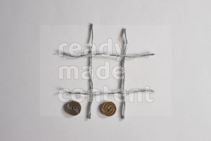 Metal buttons placed on grey background