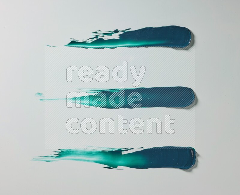Turquoise painting knife strokes on white background