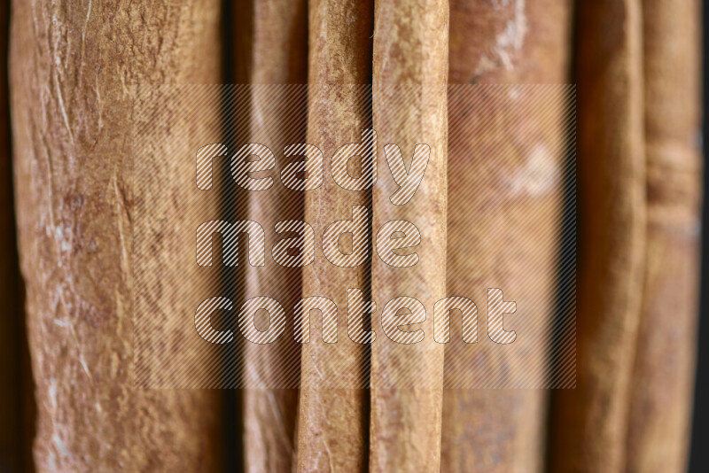 Cinnamon sticks on black background