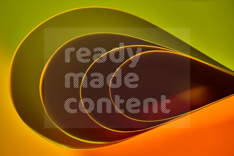 An abstract art of paper folded into smooth curves in green and orange gradients