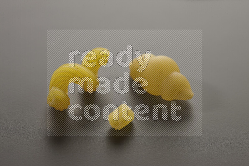 Different pasta types on grey background