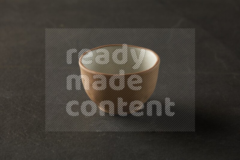 multi color round bowl on grey textured countertop