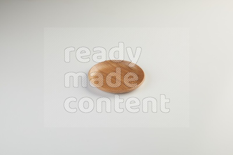 Wooden bowl and plate on white background