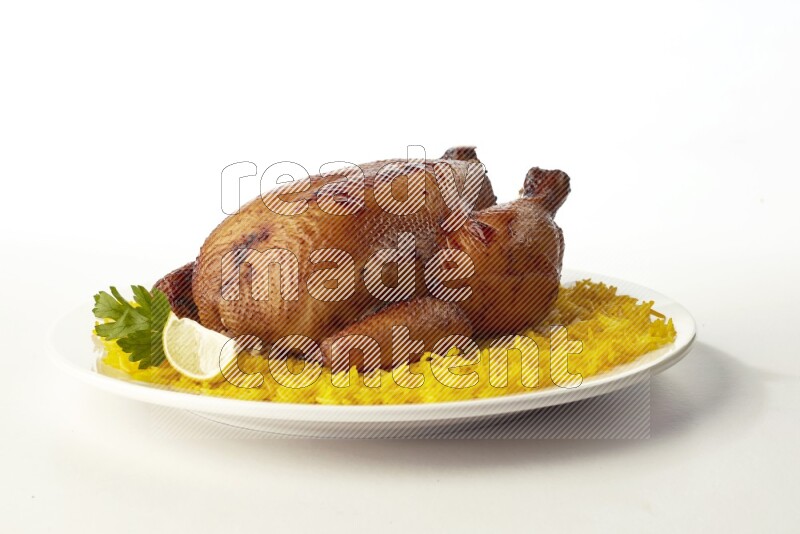 yellow  basmati Rice with  whole roasted chicken on a white rounded plate direct on white background
