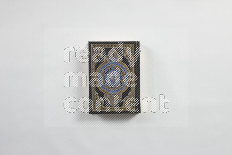 Quran with a prayer beads on white background