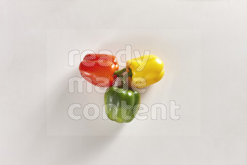 Assorted bell peppers on white background