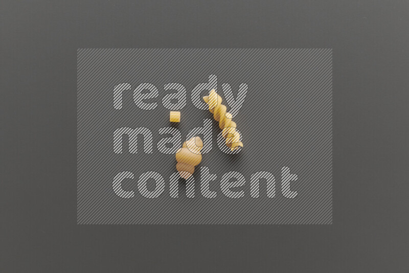 Different pasta types on grey background