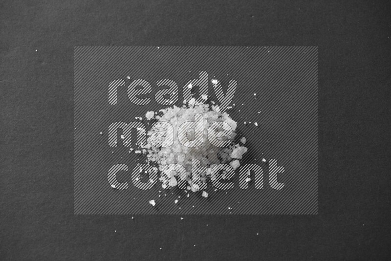 Salt on a black flooring