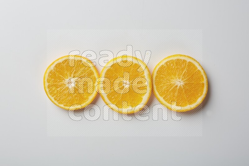 Three orange slices on a white background