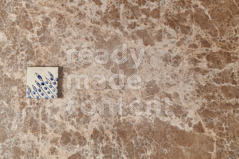 A decorative coaster on beige marble background