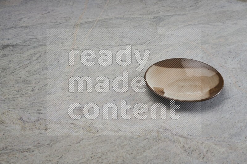 Multicolored Pottery Plate On Grey Marble Flooring