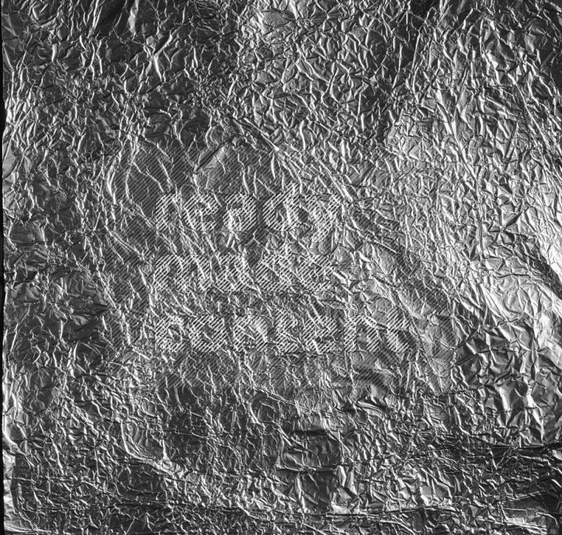 Aluminium foil on black background