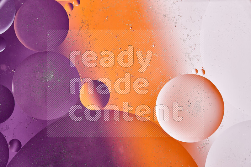 Close-ups of abstract oil bubbles on water surface in shades of white, orange and purple