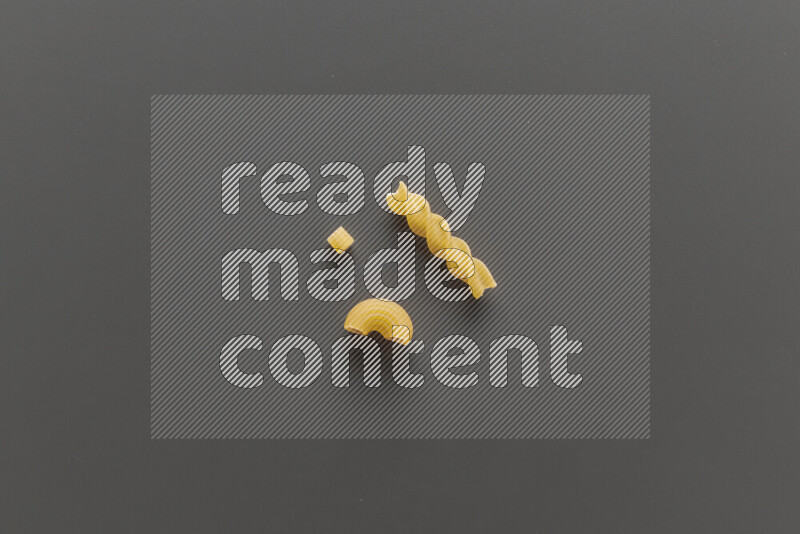 Different pasta types on grey background