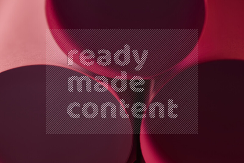 The image shows an abstract paper art with circular shapes in varying shades of red