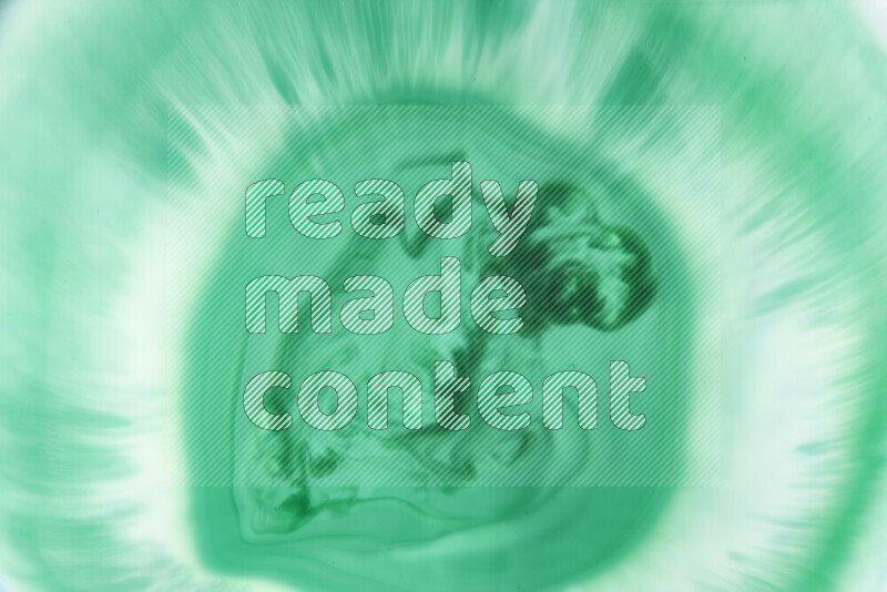 A close-up of abstract swirling patterns in green gradients