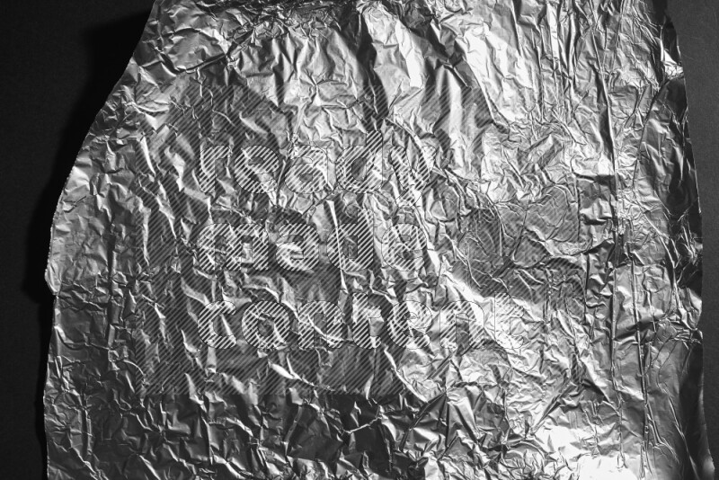 Aluminium foil on black background