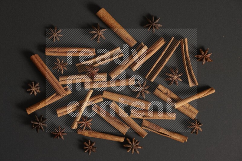 Cinnamon sticks and star anise on black background
