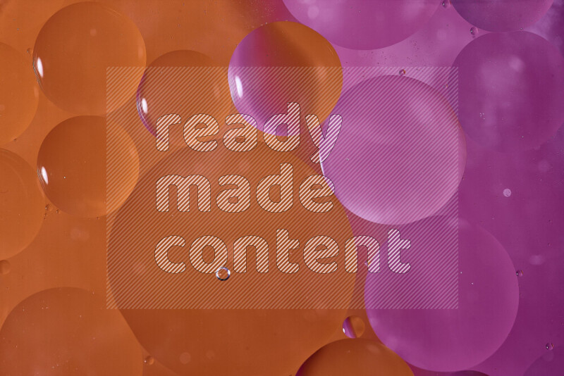 Close-ups of abstract oil bubbles on water surface in shades of orange and pink