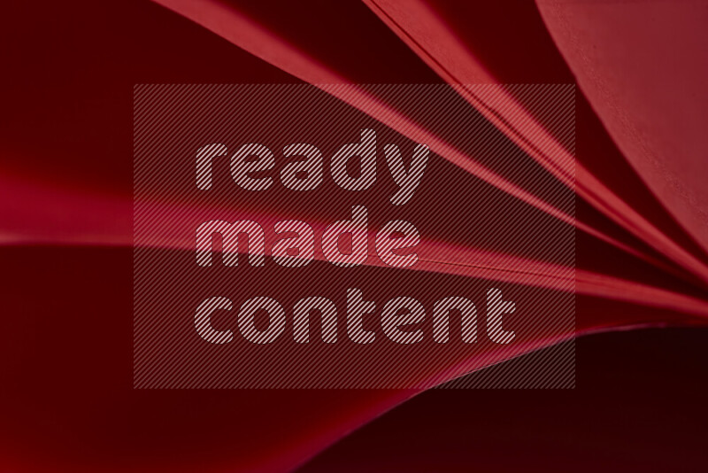 An abstract art showing red paper sheets arranged in an overlapping curves