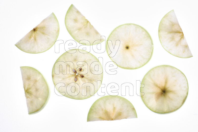Apple slices on illuminated white background