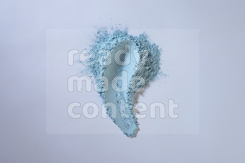 Blue powder smears on white background