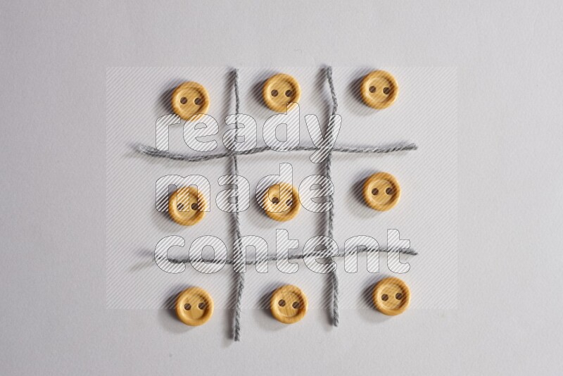 Wooden buttons placed on grey background