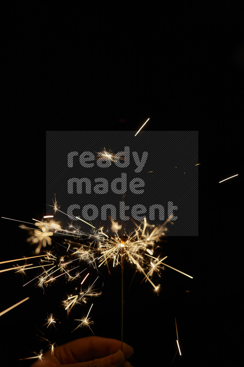 A close-up image of sparkler candle isolated on black background