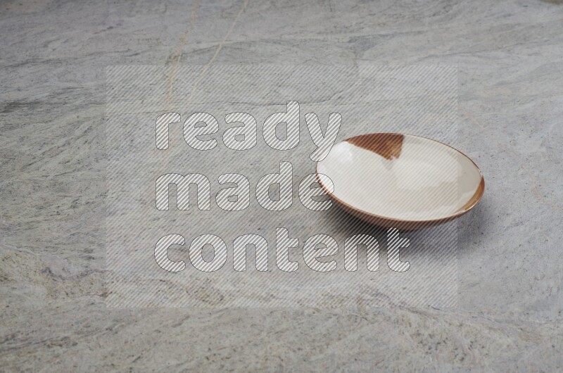 Multicolored Pottery Plate On Grey Marble Flooring