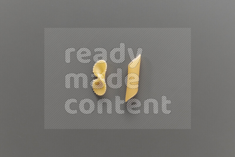 Fiocchi pasta with other types of pasta on grey background