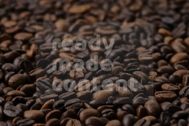 Roasted coffee beans on beige background