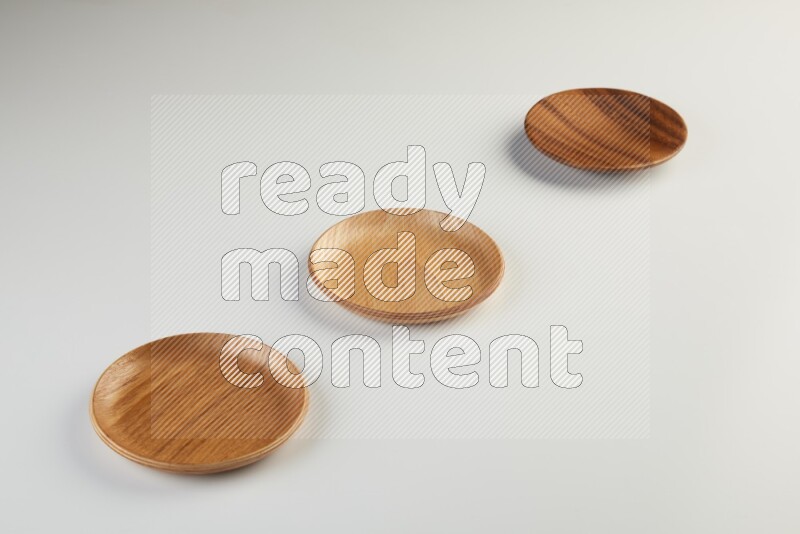 Wooden bowl and plate on white background