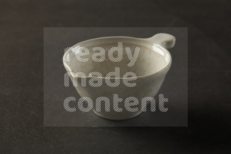 multi color round bowl on grey textured countertop