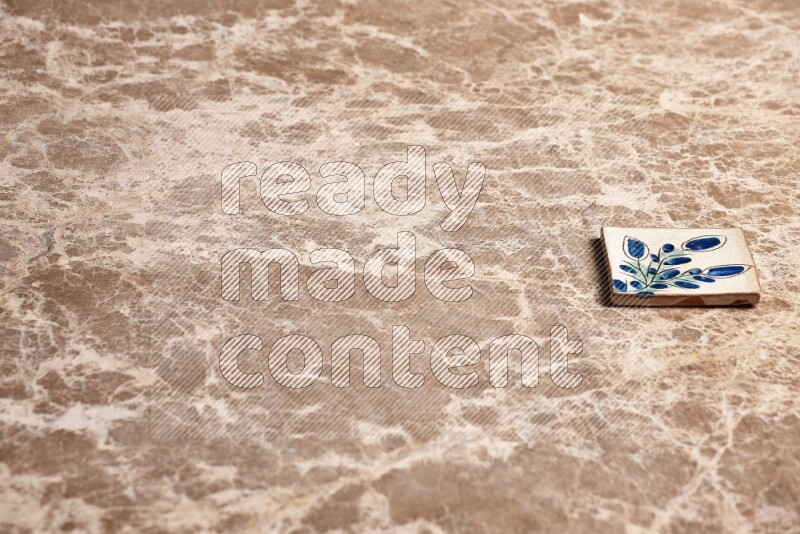 A decorative coaster on beige marble background