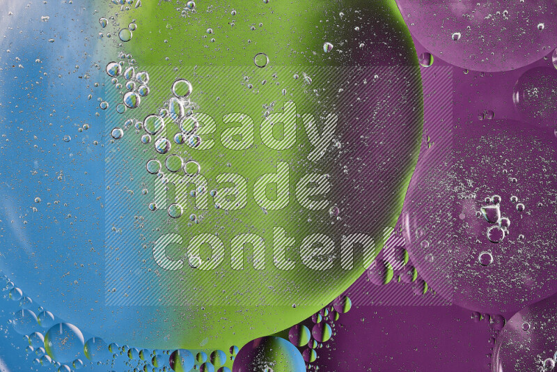 Close-ups of abstract oil bubbles on water surface in shades of purple, green and blue