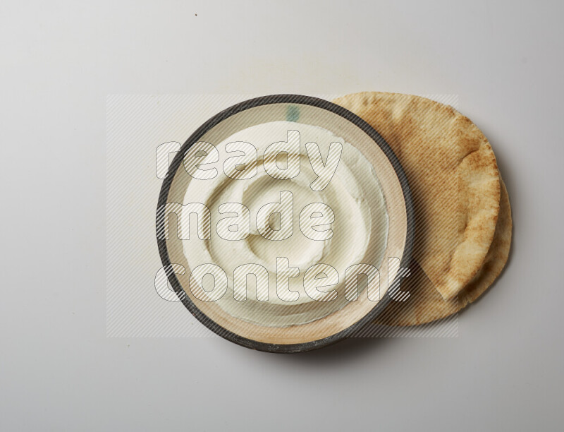 plain Lebnah in a pottery plate on a white background