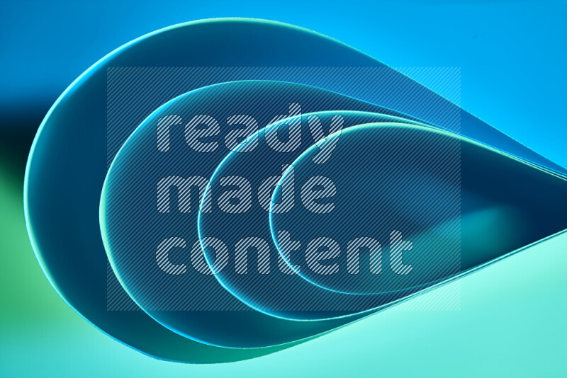 An abstract art of paper folded into smooth curves in green and blue gradients