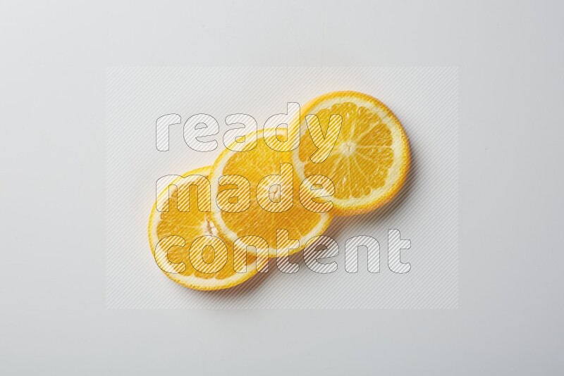 Three orange slices on a white background