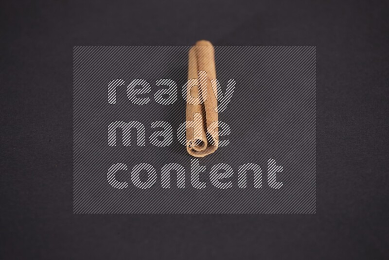 Cinnamon stick on black background