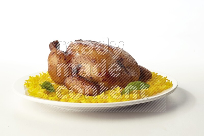 yellow  basmati Rice with  whole roasted chicken on a white rounded plate direct on white background