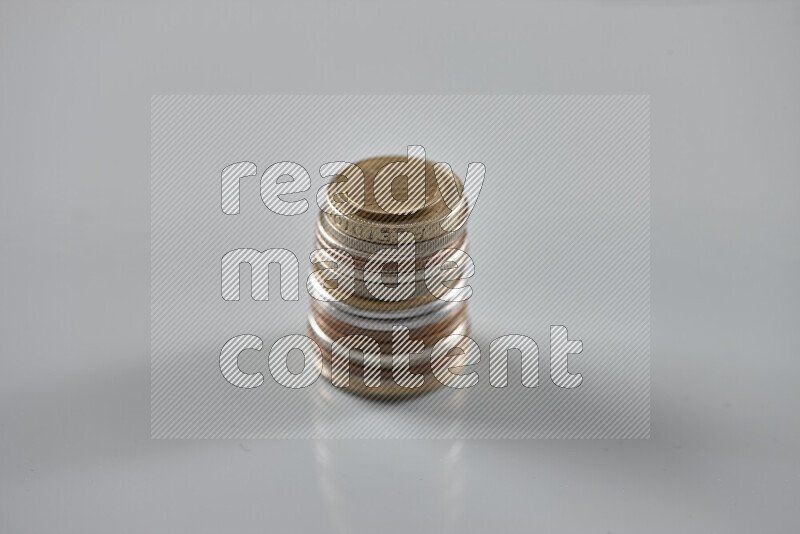 Random old coins on grey background