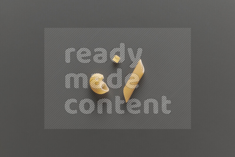 Different pasta types on grey background
