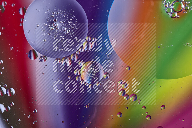 Close-ups of abstract oil bubbles on water surface in multicolors
