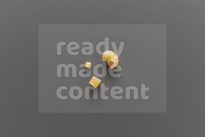 Different pasta types on grey background