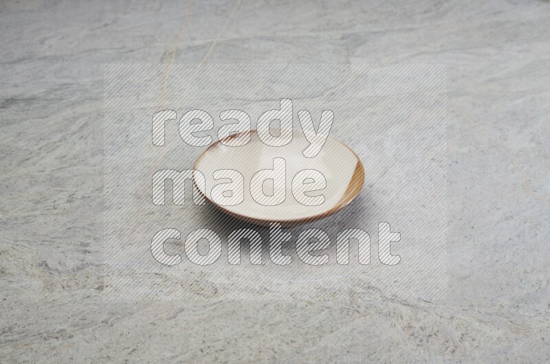 Multicolored Pottery Plate On Grey Marble Flooring