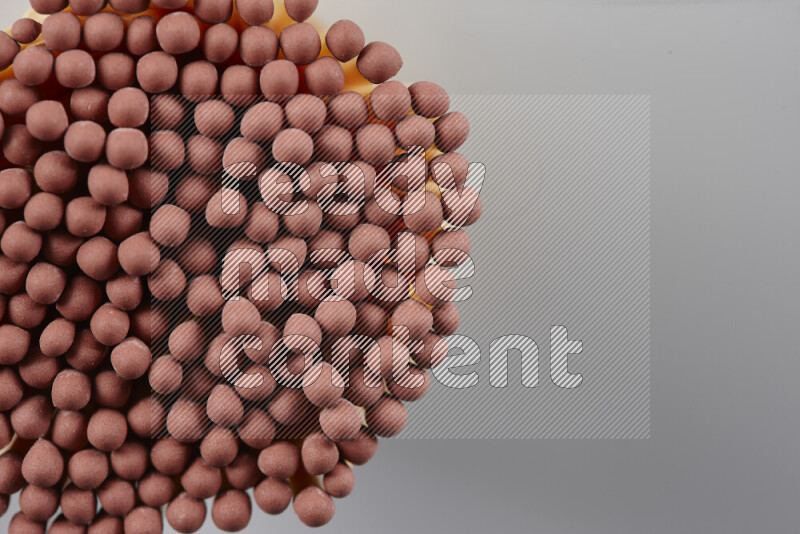 A close-up of a bundle of matches on grey background