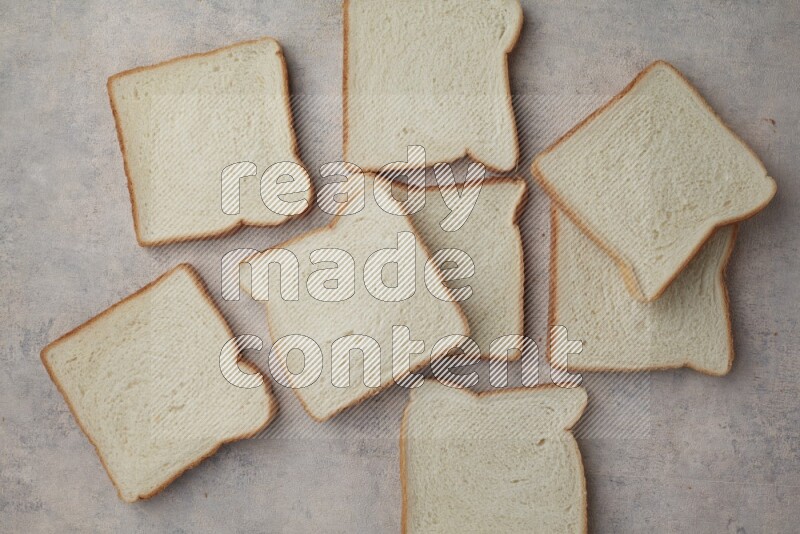 White Toast slices on alight blue textured background
