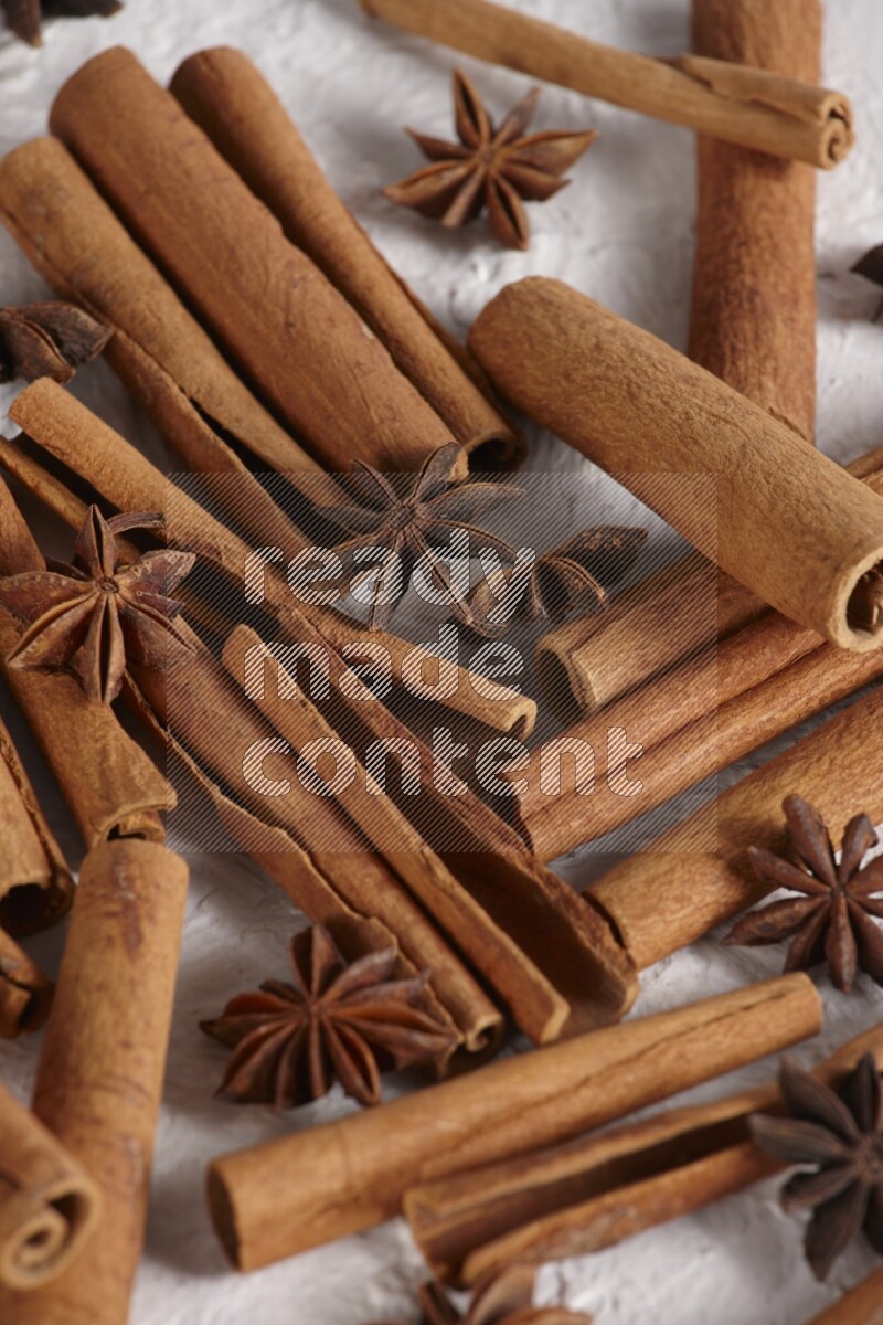 cinnamon sticks with star anise on white background