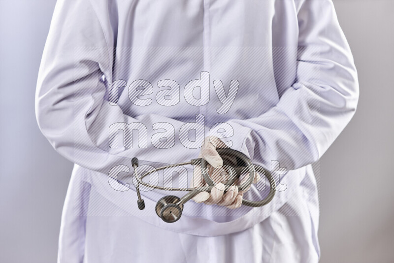Female doctor wearing an abaya and medical attire in different positions