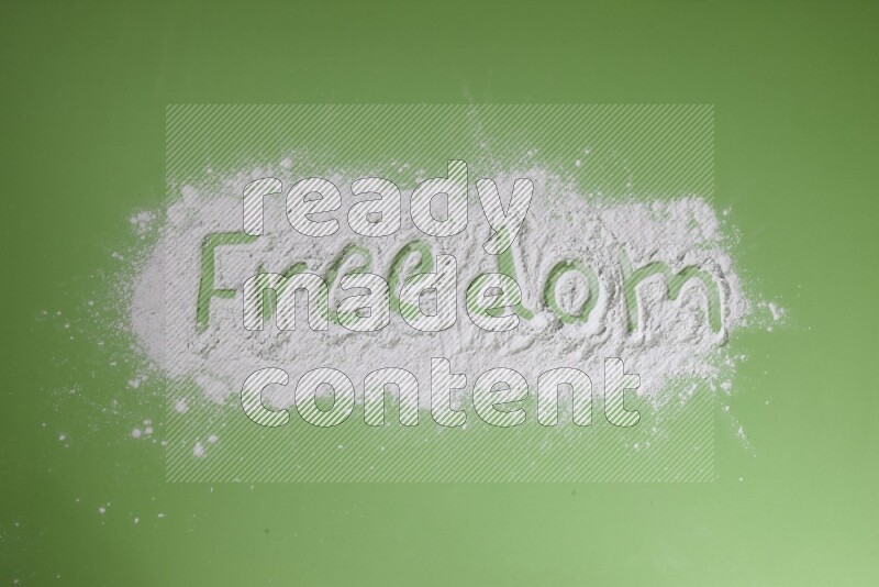 A word written with white powder on green background